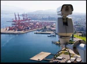 Surveillance Camera is watching  operation in the port.